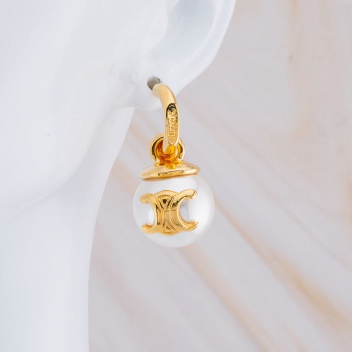 Arete con colagante de perla baño 18k