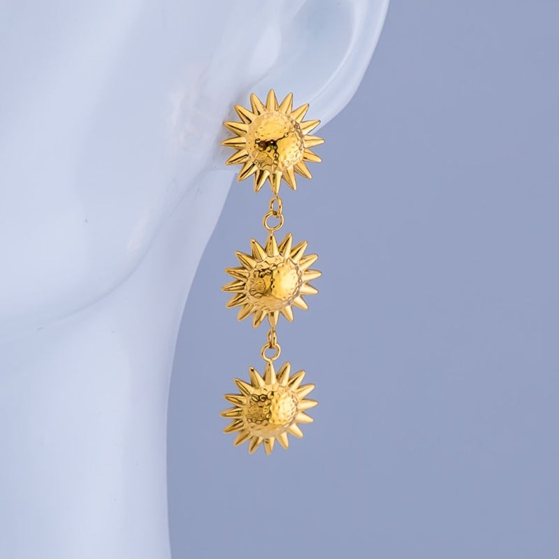 Aretes 3 soles colgantes baño 18K