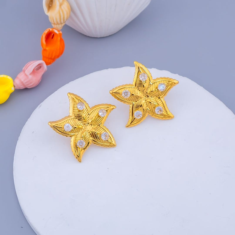 Aretes  en forma de estrella de mar  baño 18K con zirconias