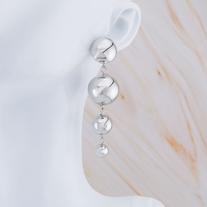 Aretes colgantes baño 18k
