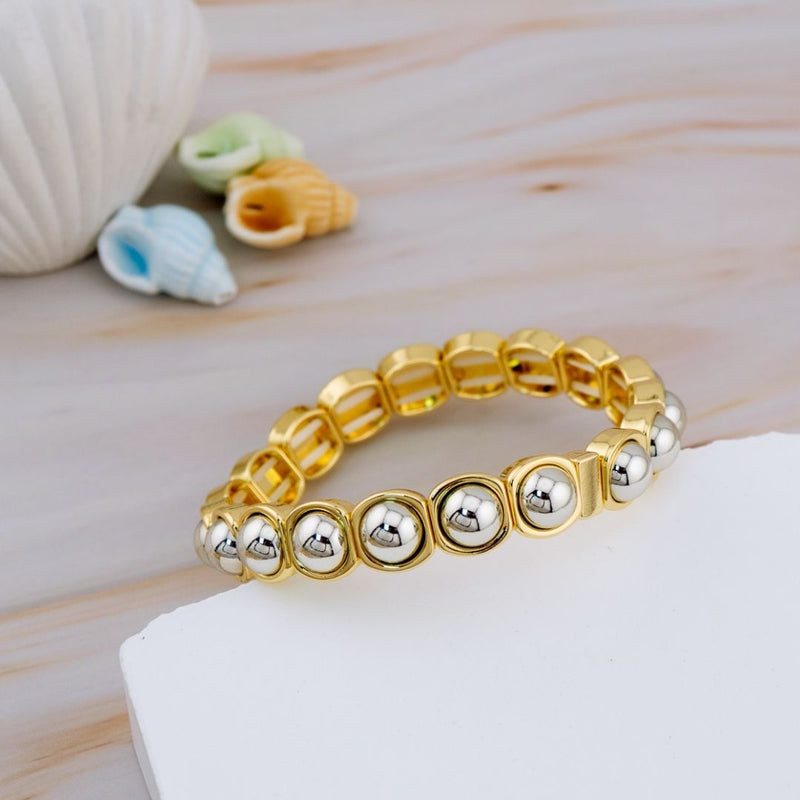 Pulsera elastica dos tonos baño 18k