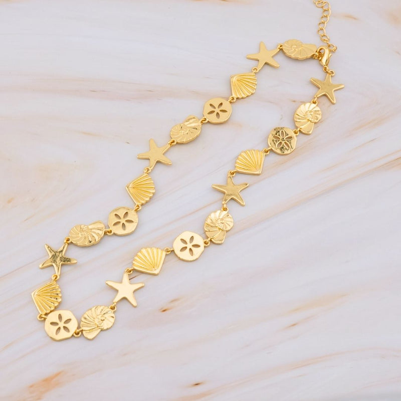Collar mar estrella concha caracol baño 18k