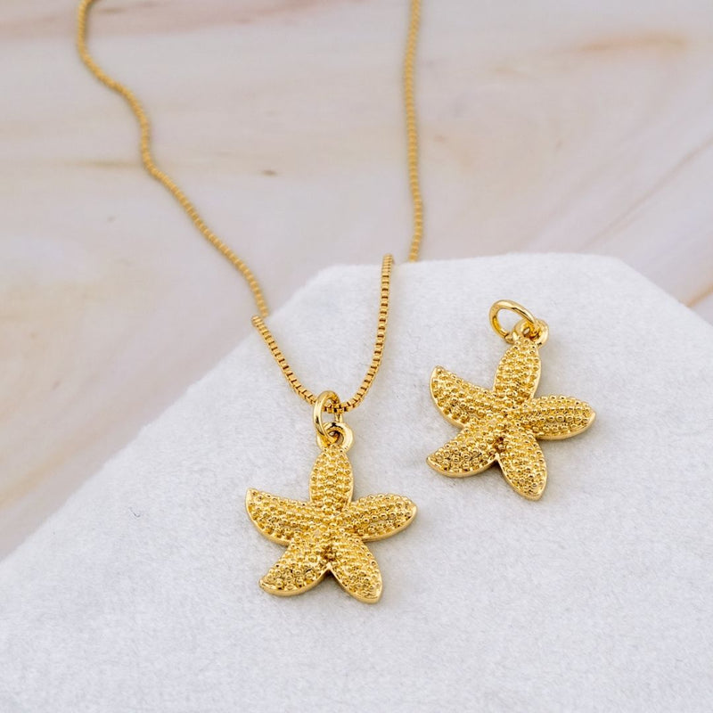 Dije en forma de estrella de mar baño 18k