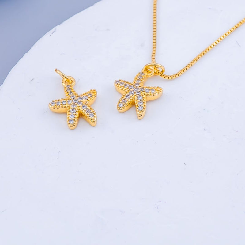 Dije micropave en forma de estrella de mar baño 18k