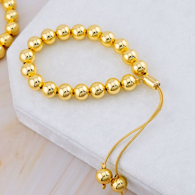 Pulsera ajustable bolitas de 8mm de baño 18k