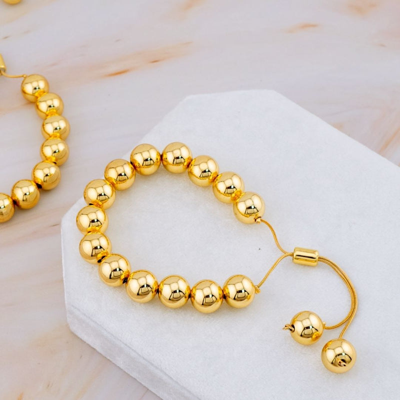 Pulsera ajustable bolitas de 10 mm de baño 18k