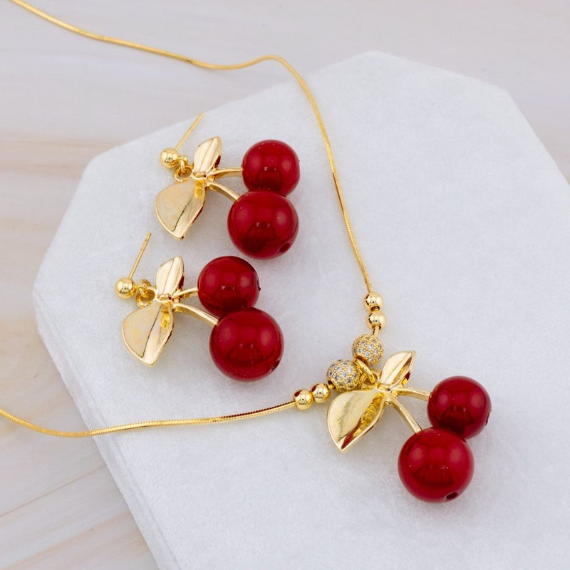 Set de aretes y collar de cerazas en baño 18k