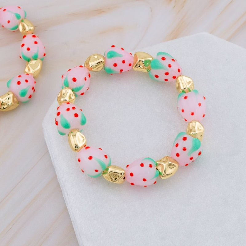 Pulsera elastica de fresa en resina y separadores en baño 18k