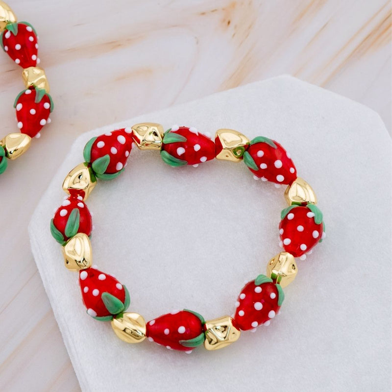 Pulsera elastica de fresa en resina y separadores en baño 18k