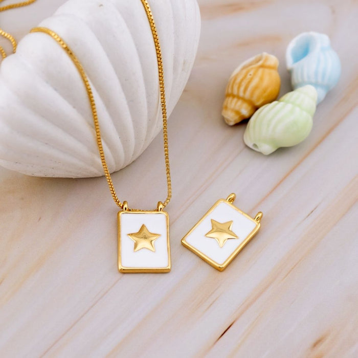 Dije medalla estrella esmaltado baño 18k