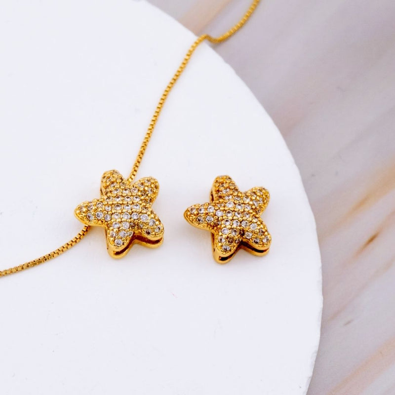 Dije estrella micropave con baño 18k
