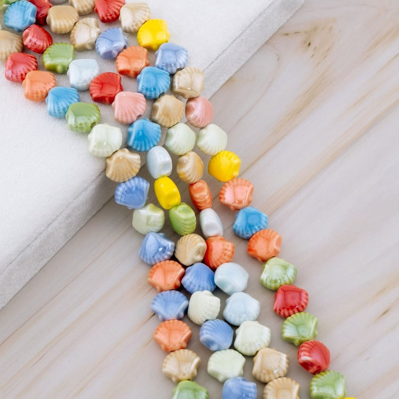 Piedra ceramica en forma de concha de mar multicolor