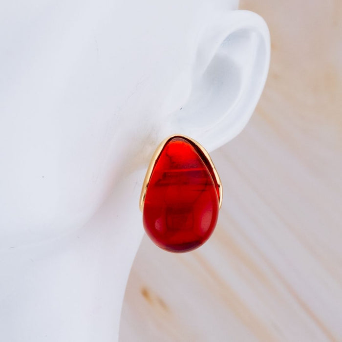 Aretes stud luna carey baño 18k
