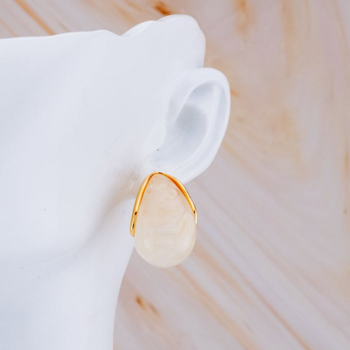 Aretes stud luna carey baño 18k