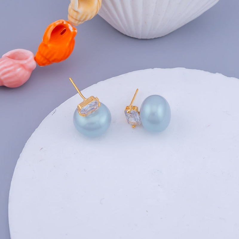 Aretes stud con perlas zirconia y baño 18k