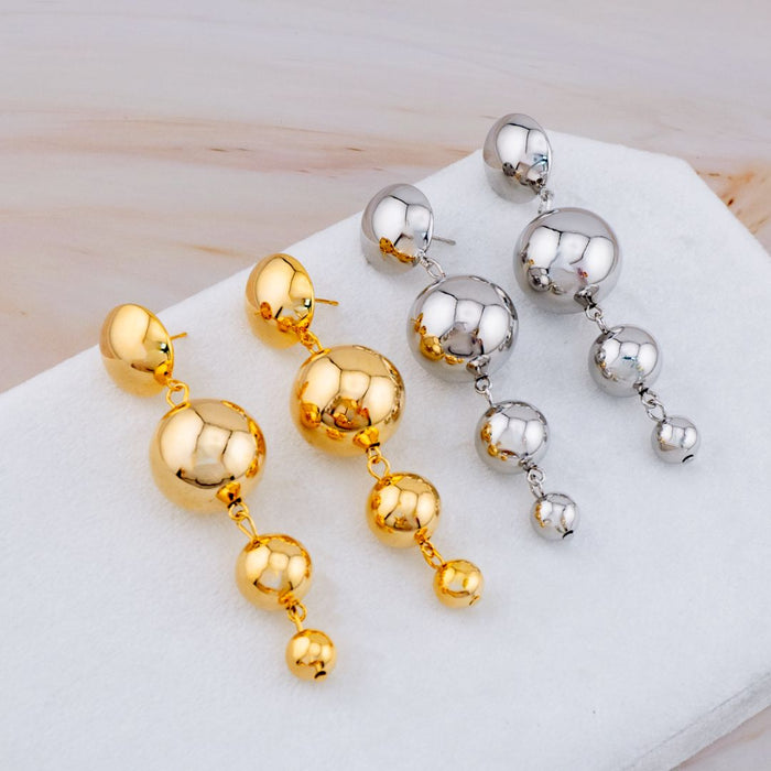 Aretes colgantes baño 18k
