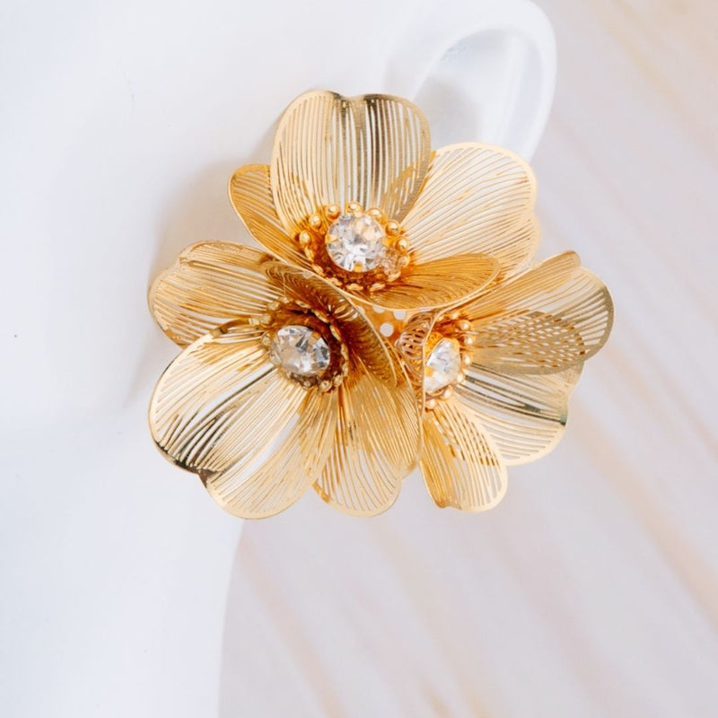 Aretes flor baño 18k